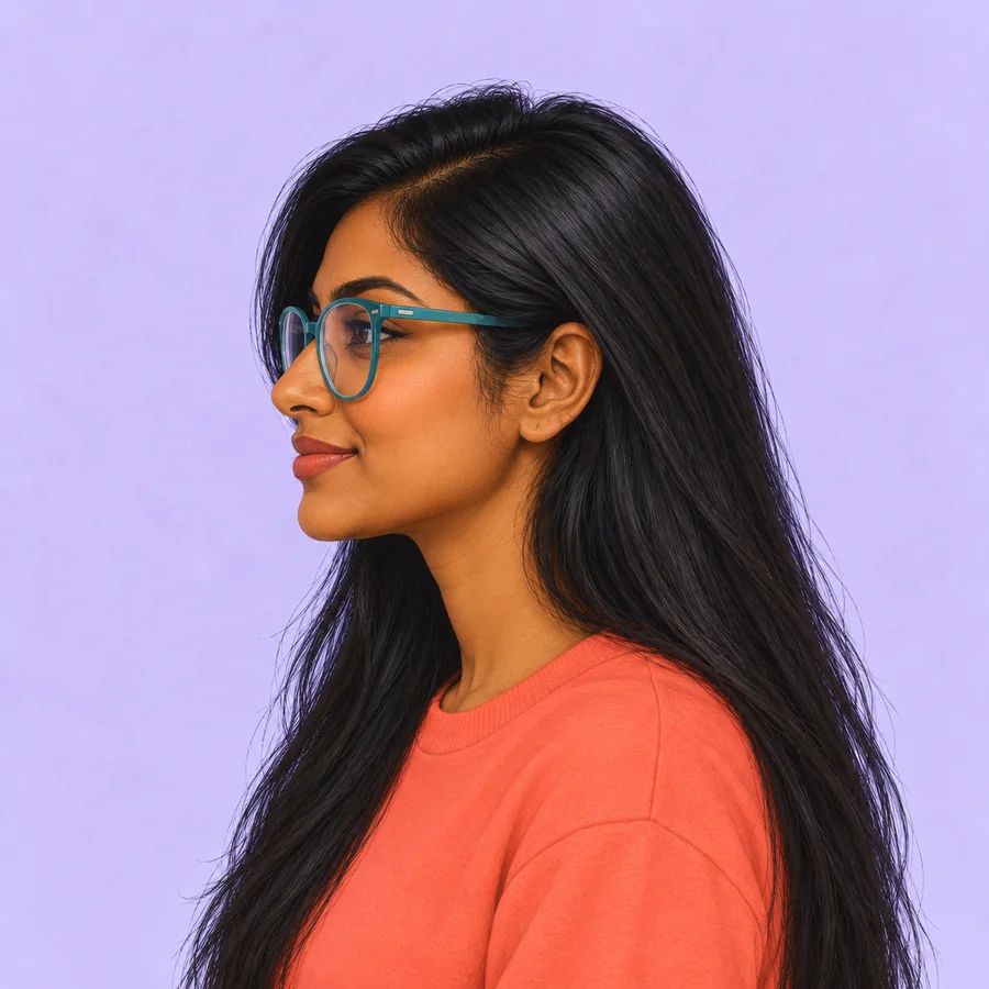Side view of the same long-haired woman with turquoise glasses and a coral crewneck