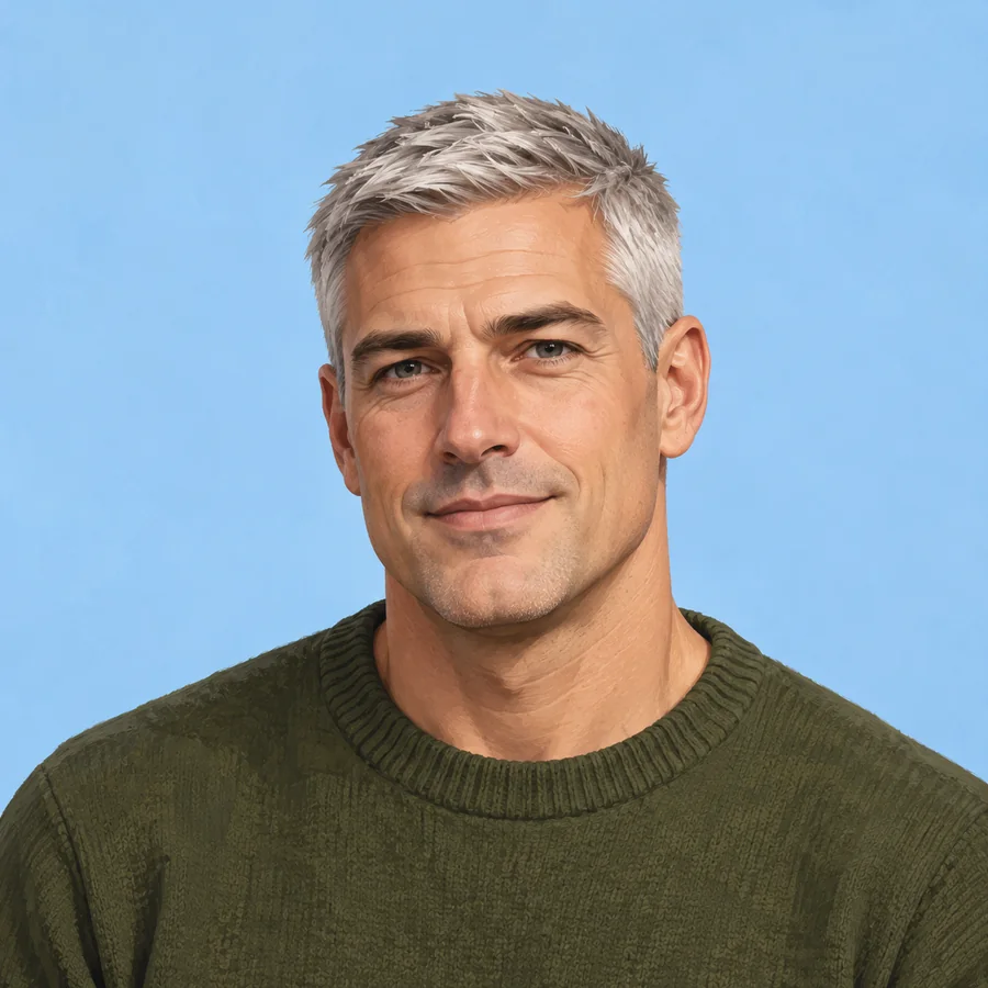 Illustrated adult man with short silver hair and a dark-green crewneck against blue