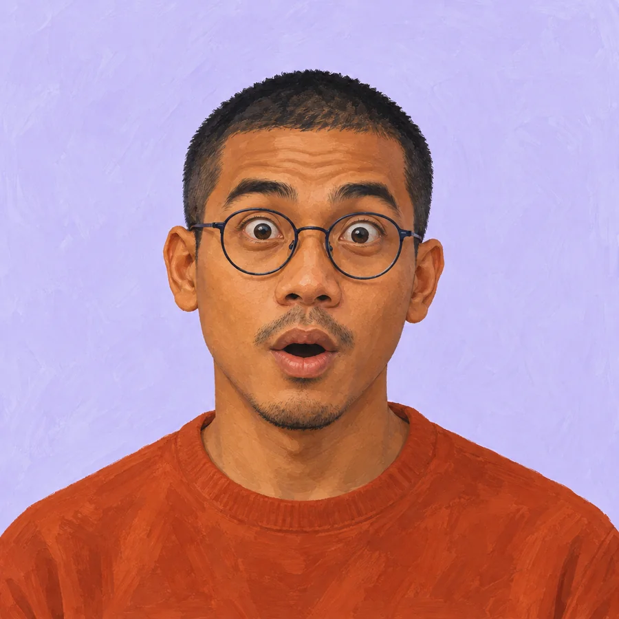 The same glasses-wearing man with raised brows, wide eyes and a rounded surprised mouth